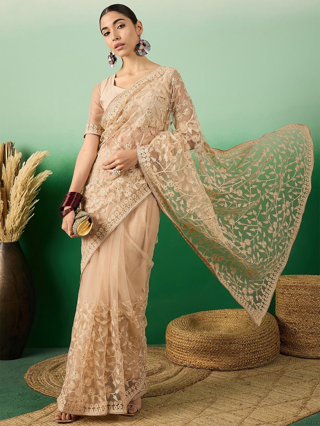 

DEVATITHI Embellished Embroidered Beige Net Saree