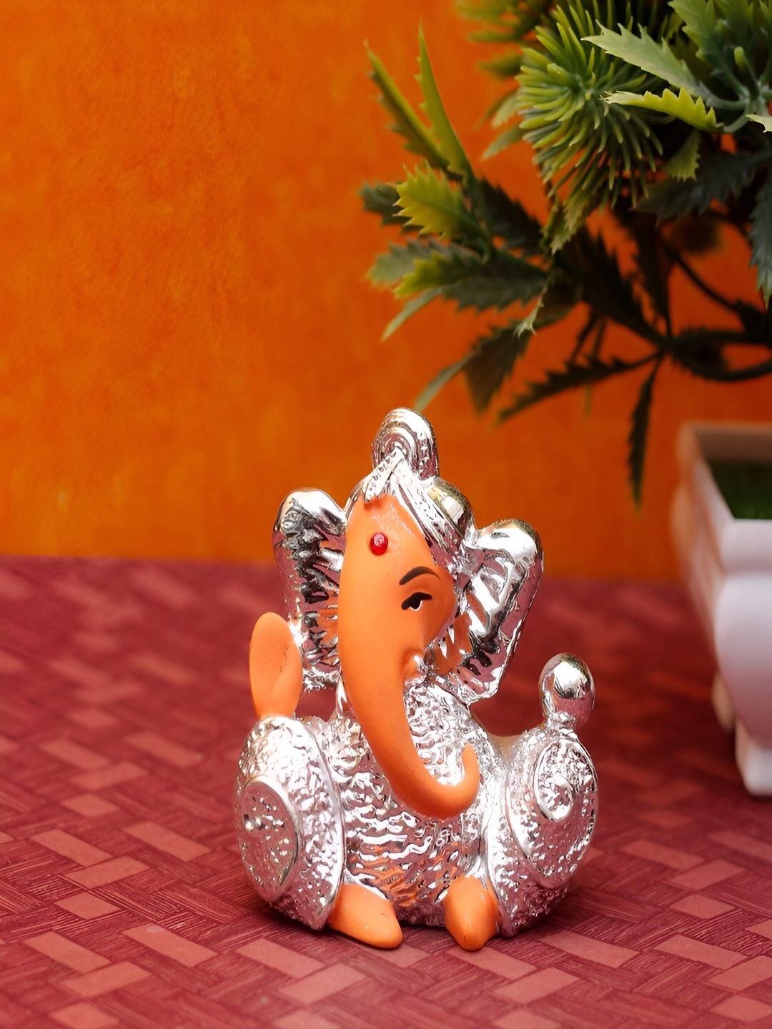 

Craftlayout Silver-Toned & Orange Ganesha JI Religious Idol Showpiece