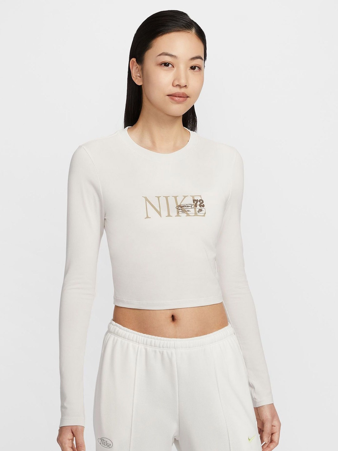 

Nike Women Sportswear Chill Knit Brand Logo Printed Monochrome Cotton Crop Top, White