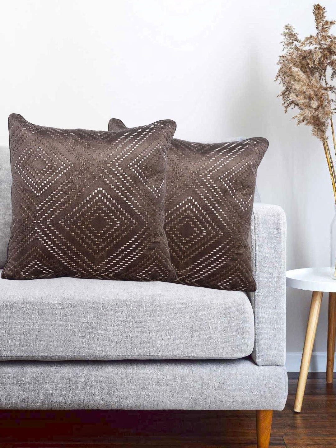 

Vinayaka Fab Brown 2 Pieces Geometric Embroidered Velvet Square Shaped Cushion Covers