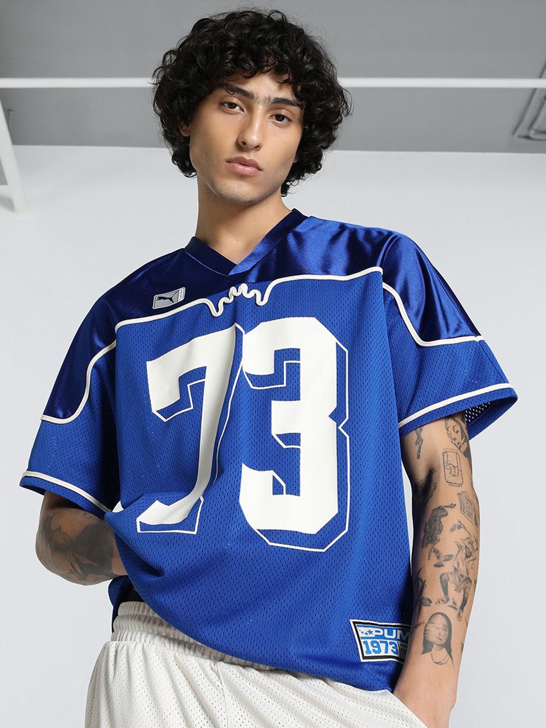 

Puma Men Dress Code Varsity Printed Short Sleeve Football Jersey T-shirt, Blue