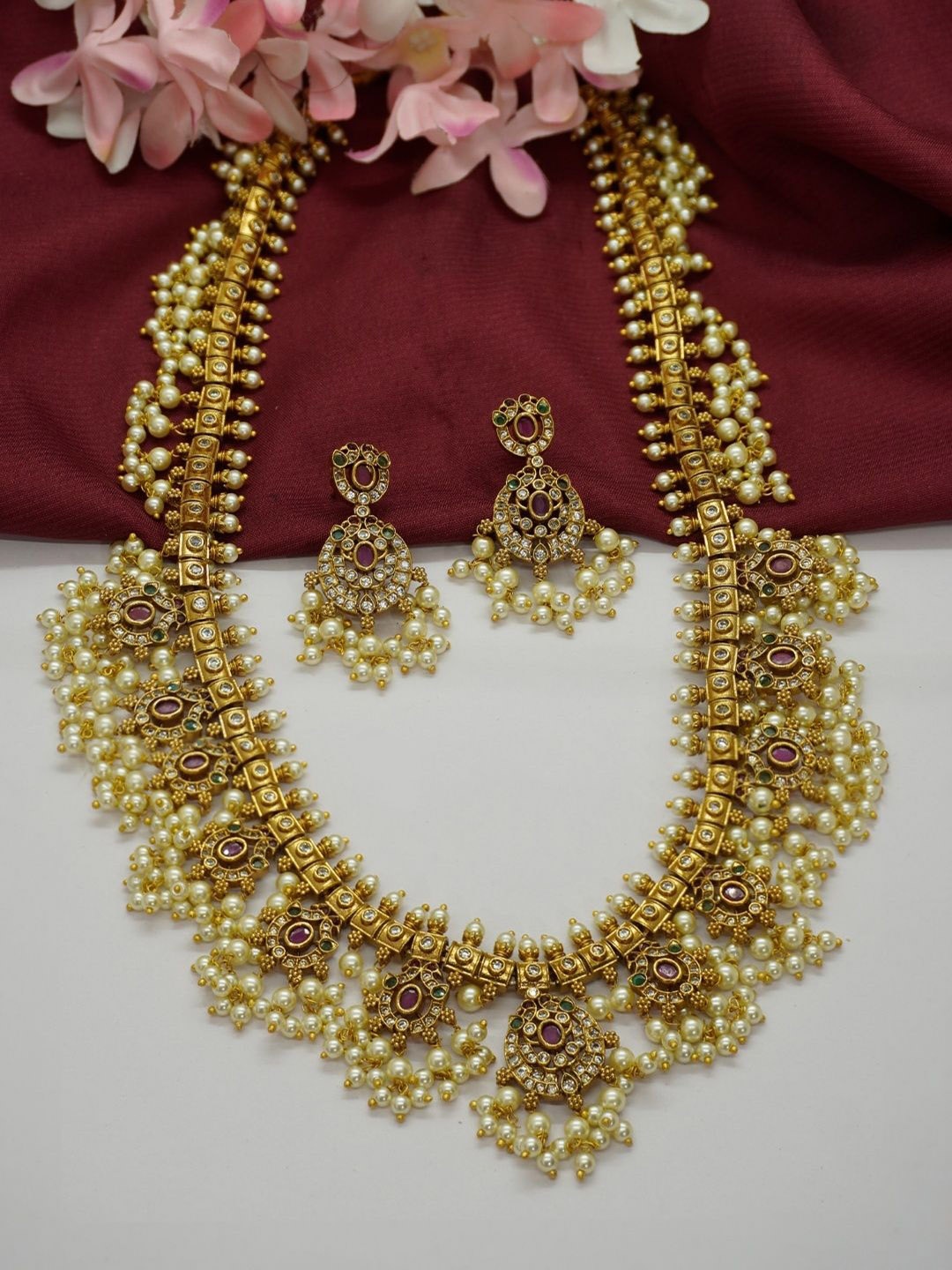 

Niscka Gold-Plated Artificial Stones Studded And Beaded Jewellery Set