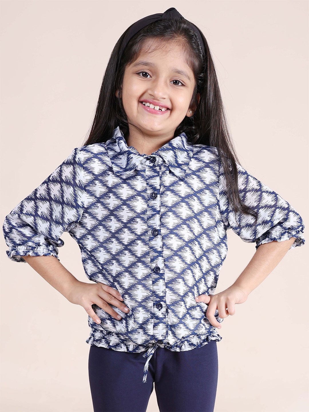 

KiddoPanti Girls Ethnic Motifs Printed Shirt Style Top, White