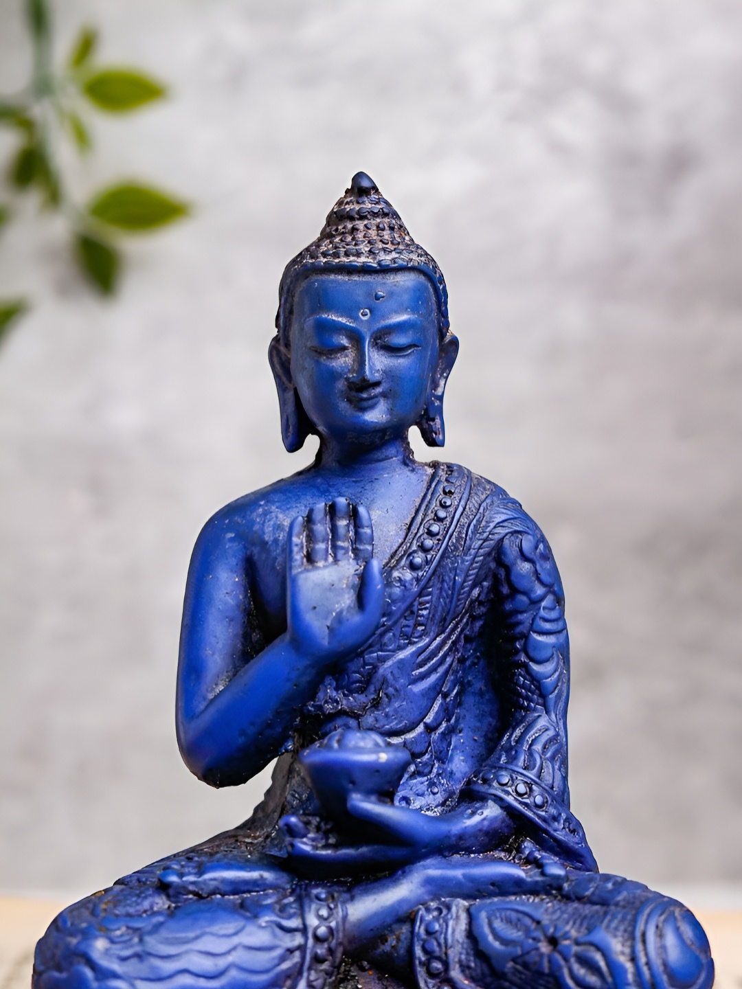 

The Advitya Blue Blessing Buddha Idol Showpiece