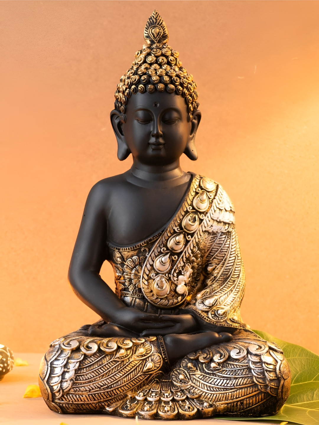 

The Advitya Black And Gold-Toned Lord Gautama Buddha Idol Showpiece
