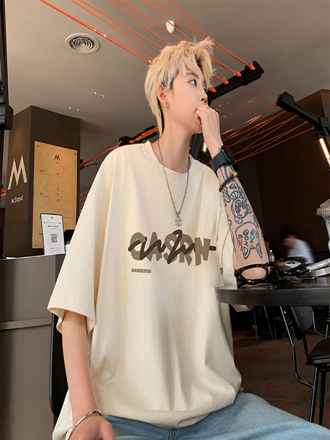

StyleCast x Revolte Men Typography Printed Round Neck Oversized T-shirt, Beige