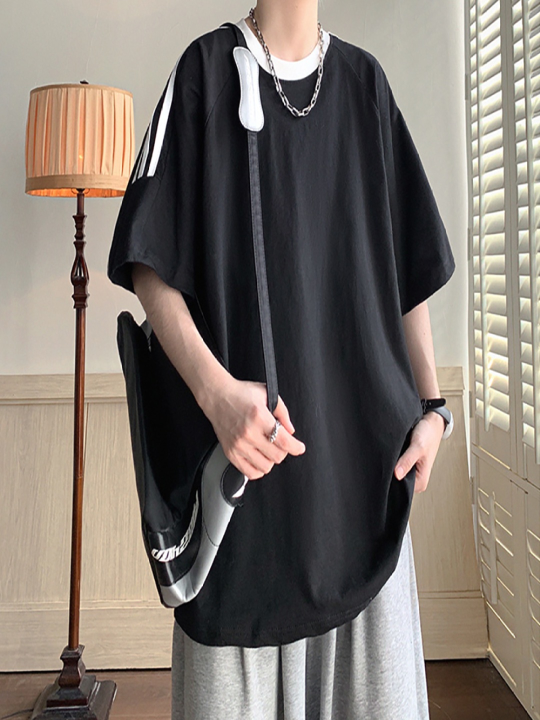 

StyleCast x Revolte Men Striped Round Neck Cotton Oversized T-shirt, Black