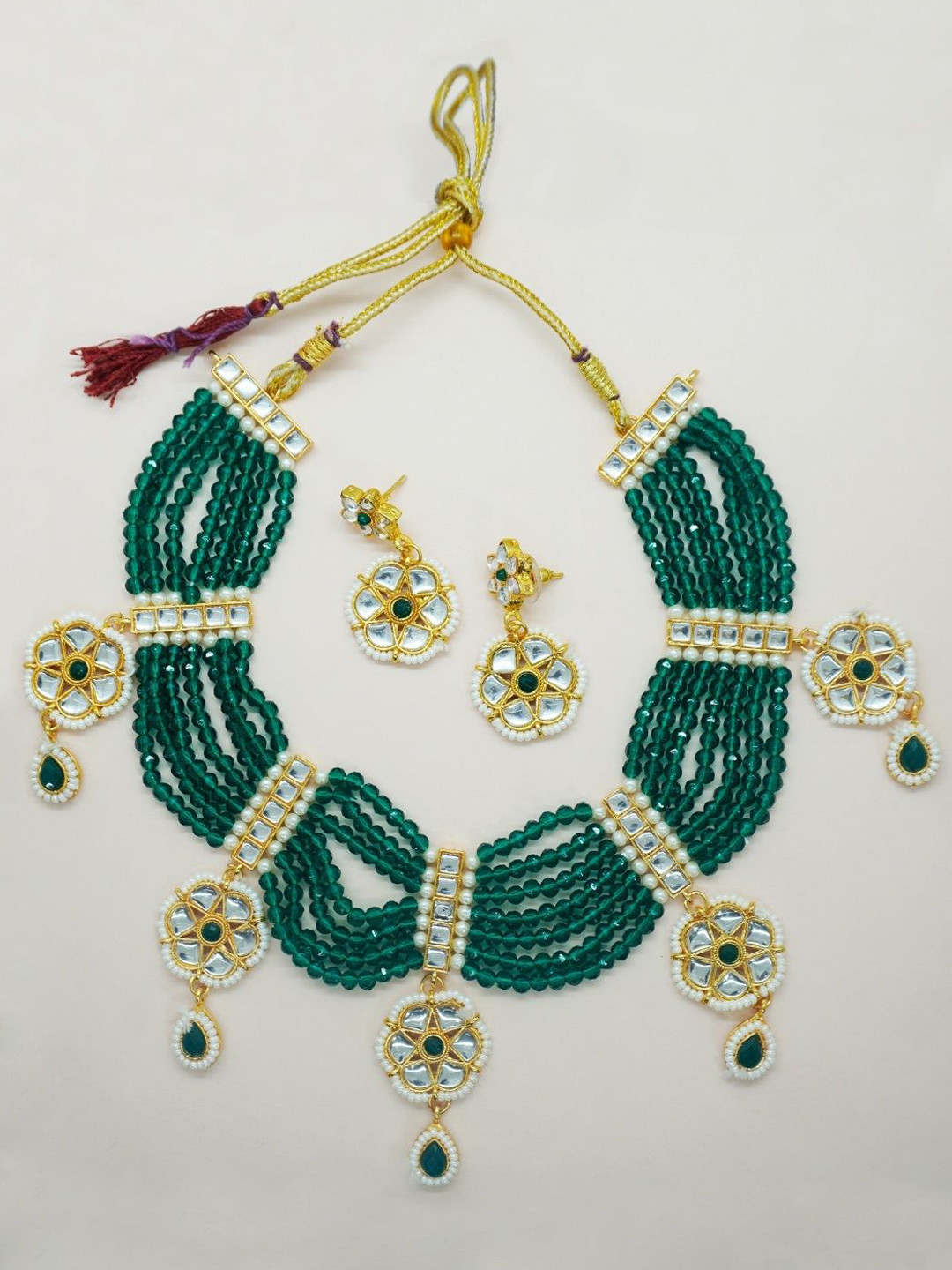 

Niscka Gold-Plated Kundan Stones Studded And Beaded Jewellery Set