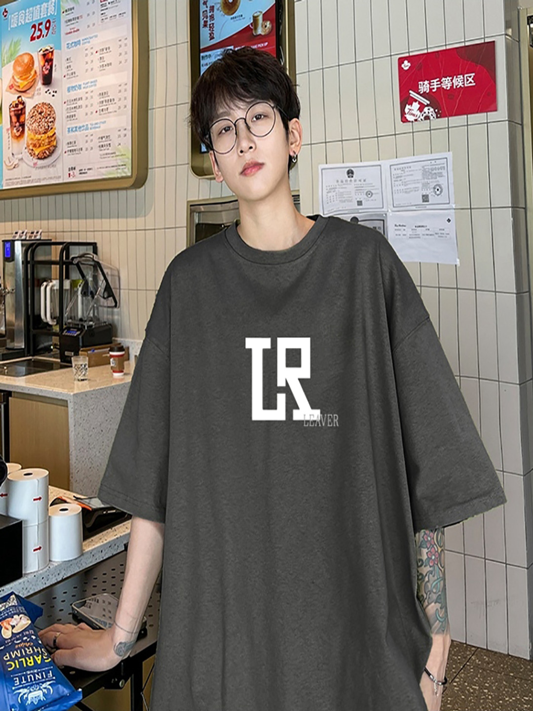 

StyleCast x Revolte Men Graphic Printed Round Neck Cotton Oversized T-shirt, Grey