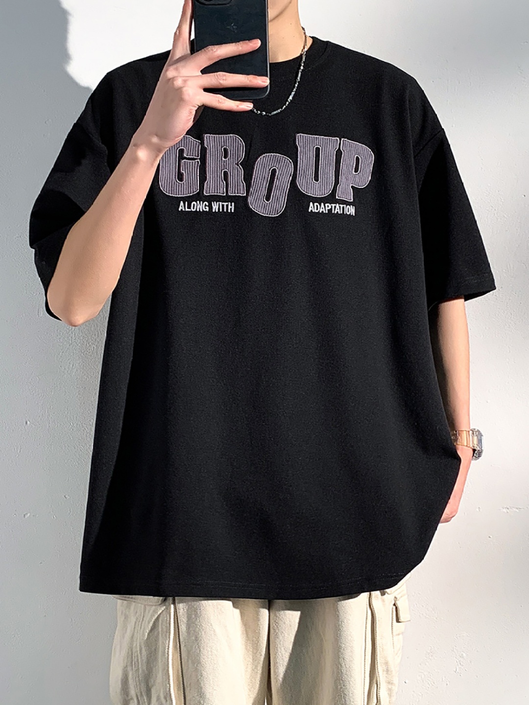

StyleCast x Revolte Men Typography Printed Round Neck Oversized T-shirt, Black