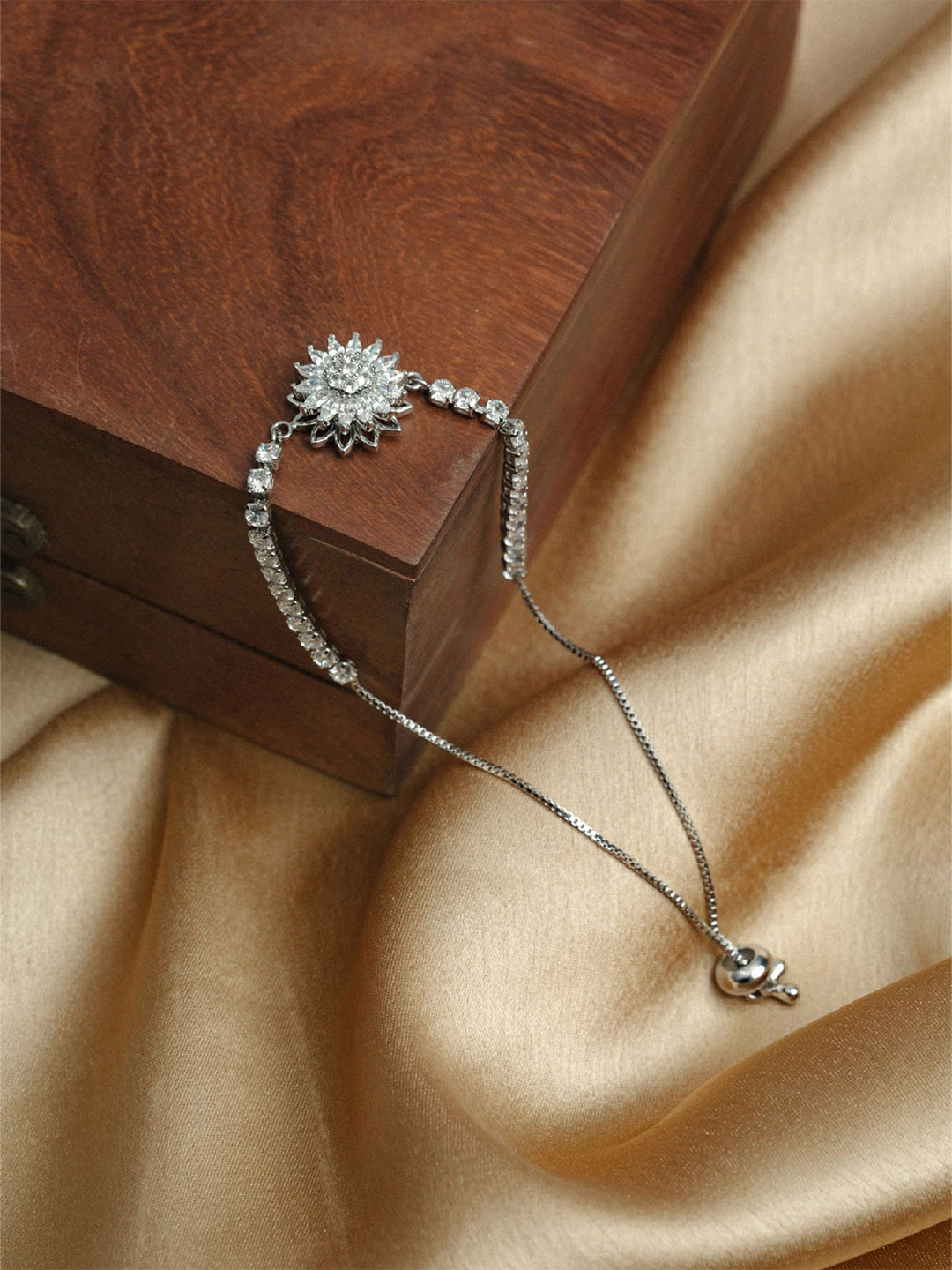 

ARTKLIM Silver-Plated American Diamond Studded Stainless Steel Floral Charm Bracelet