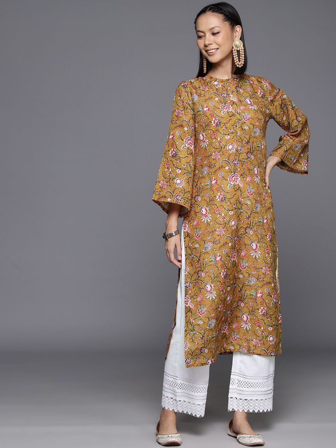 

Varanga Women Floral Printed Flared Sleeves Floral Kurta, Mustard