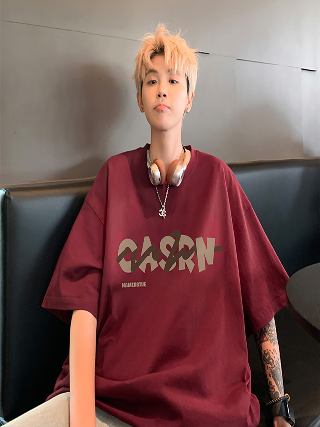 

StyleCast x Revolte Men Typography Printed Round Neck Oversized T-shirt, Maroon