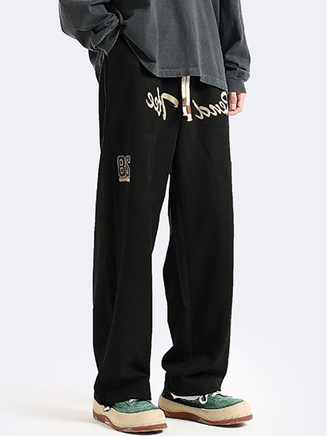 

StyleCast x Revolte Men Printed Loose Fit Easy Wash Pleated Chinos Trousers, Black