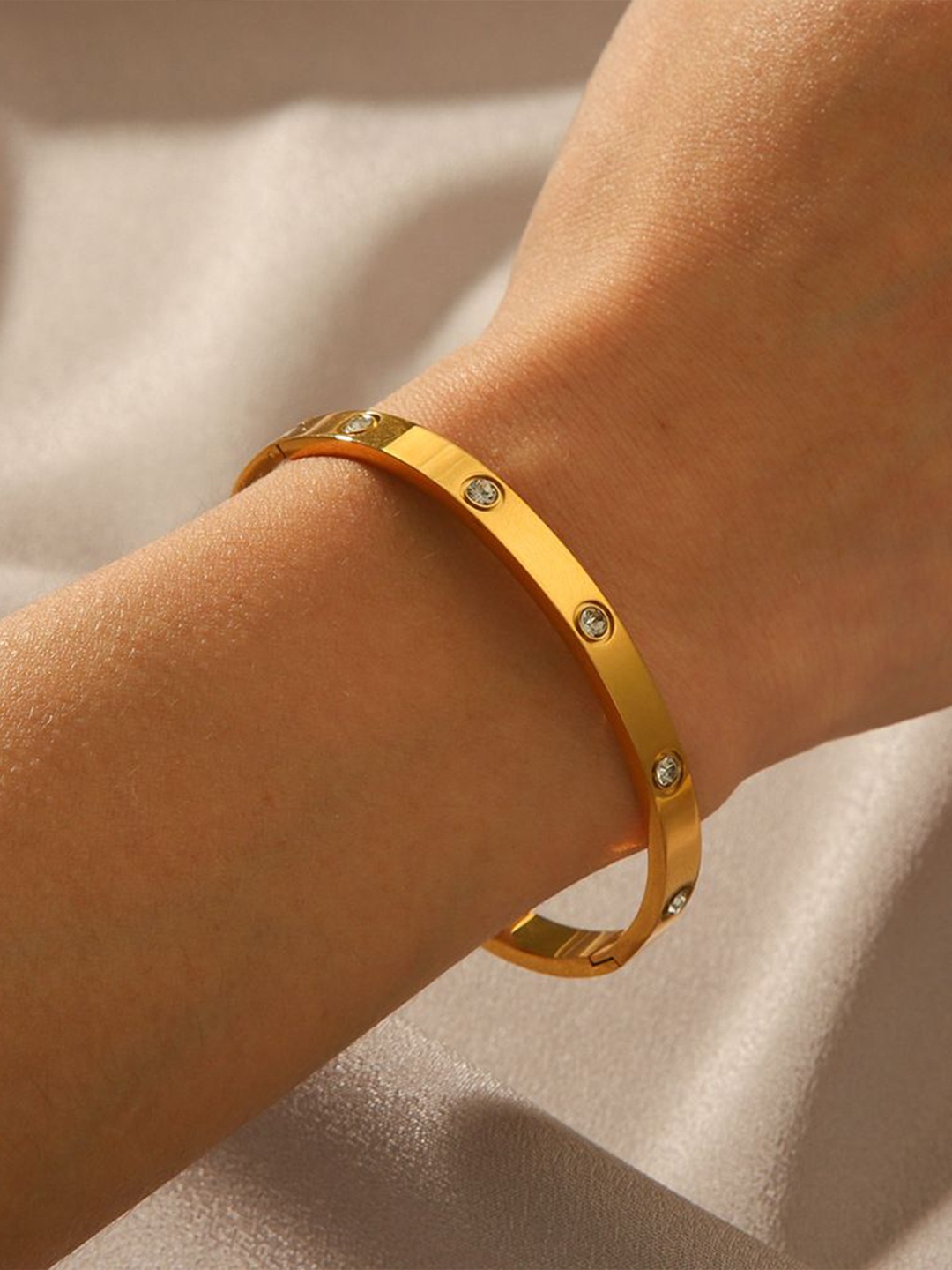 

KAORI BY SHREYA AGARWAL Gold-Plated Cubic Zirconia Studded Stainless Steel Bangle Bracelet