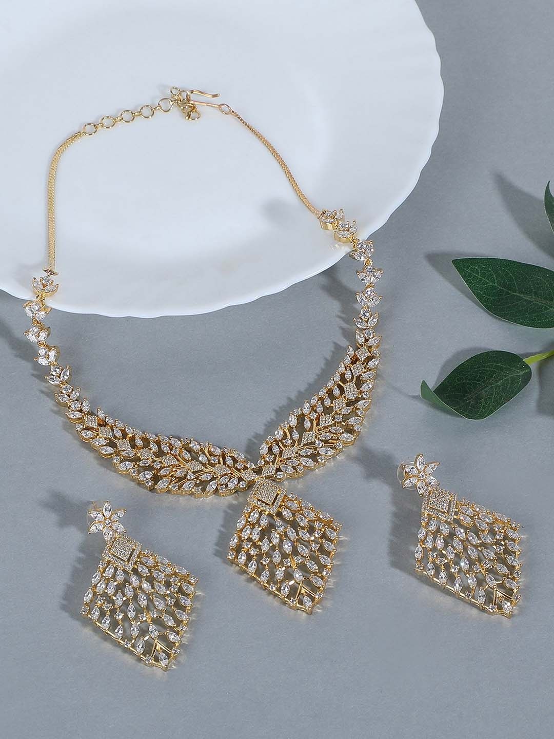 

AURAA TRENDS Gold-Plated American Diamond Stones Studded Jwellery Set