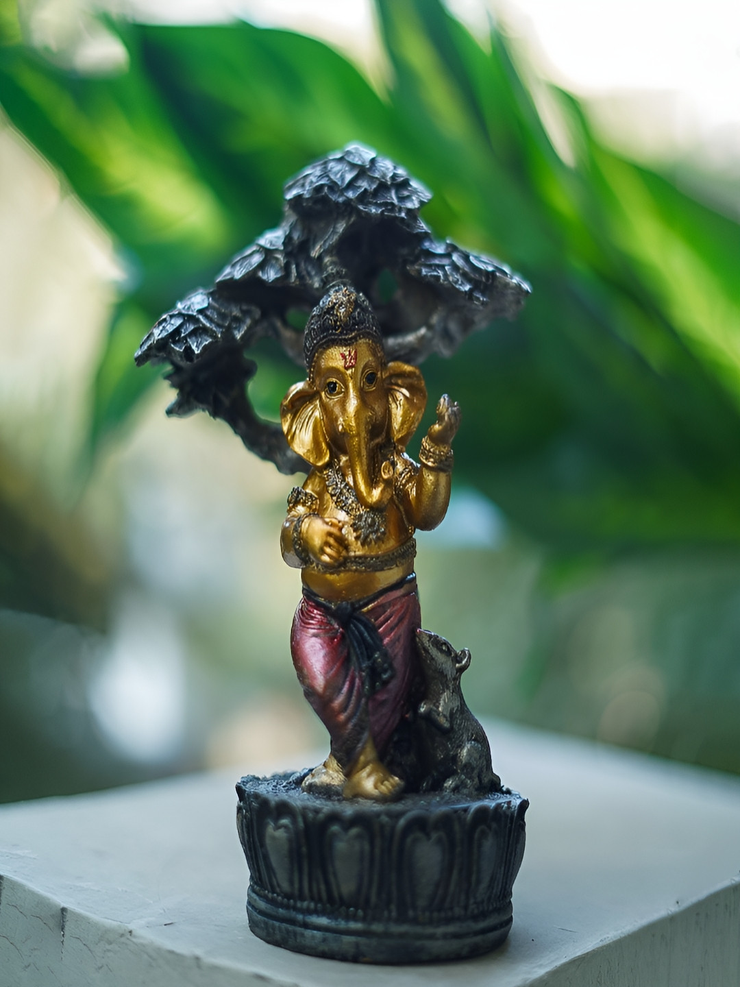 

Craftlayout Statue Gold-Toned & Black Lord Ganesh Sitting On Tree Religious Idol Showpiece