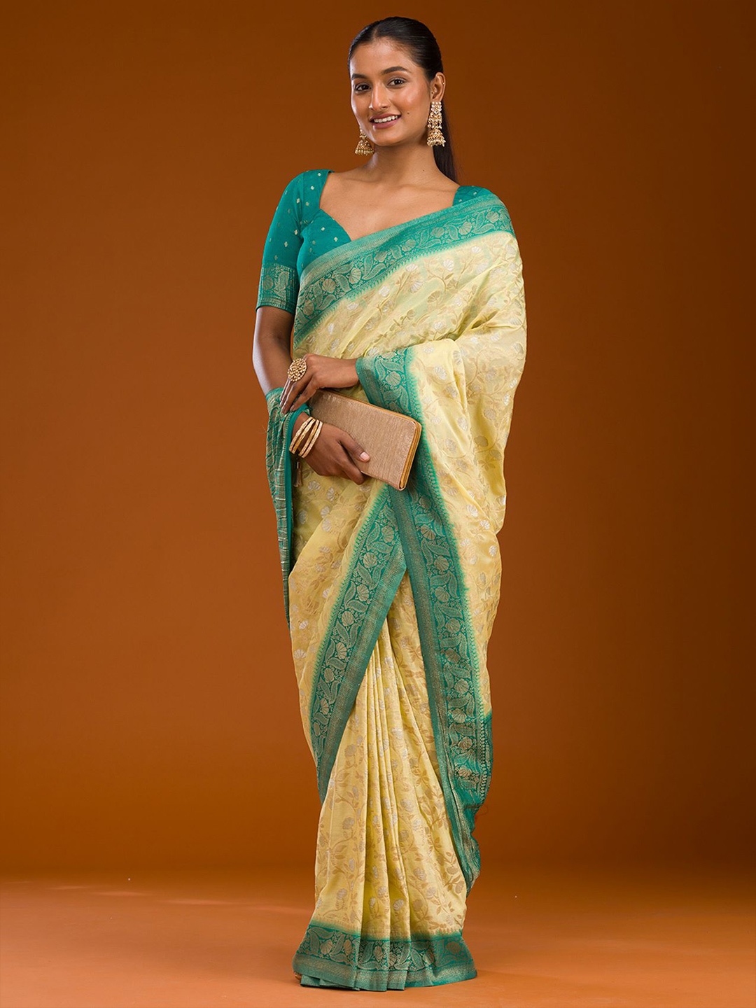 

Koskii Yellow Zari work Georgette Saree