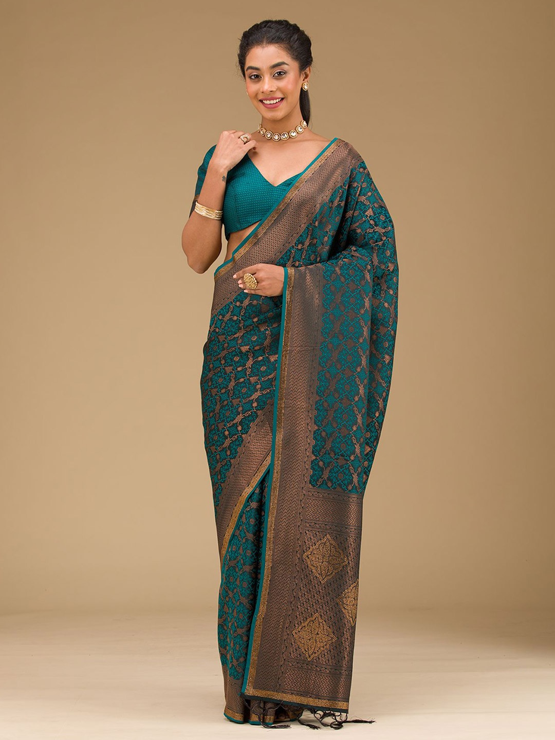 

Koskii Peacock Blue Stonework Art Silk Saree