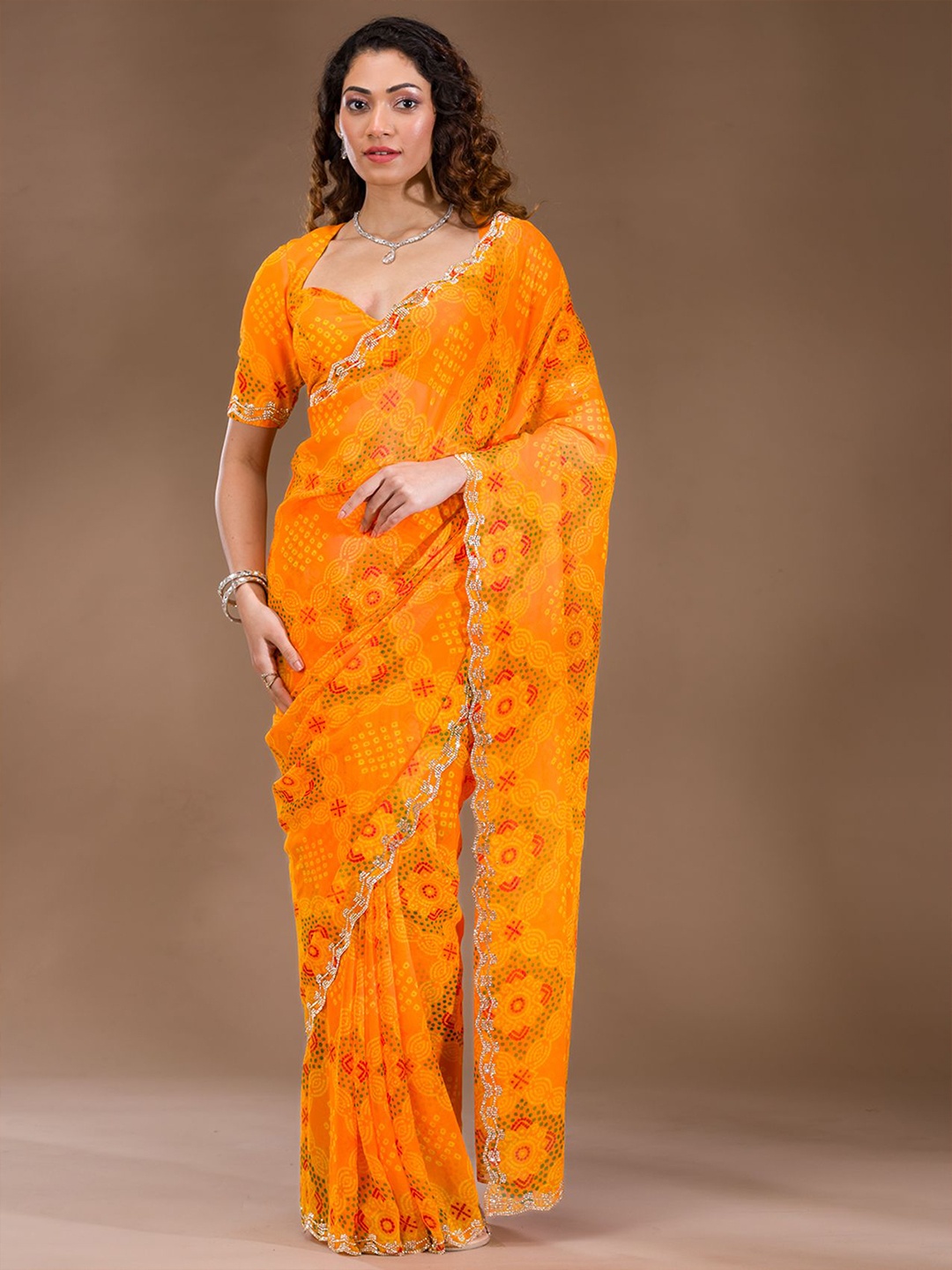 

Koskii Orange Stonework Georgette Saree