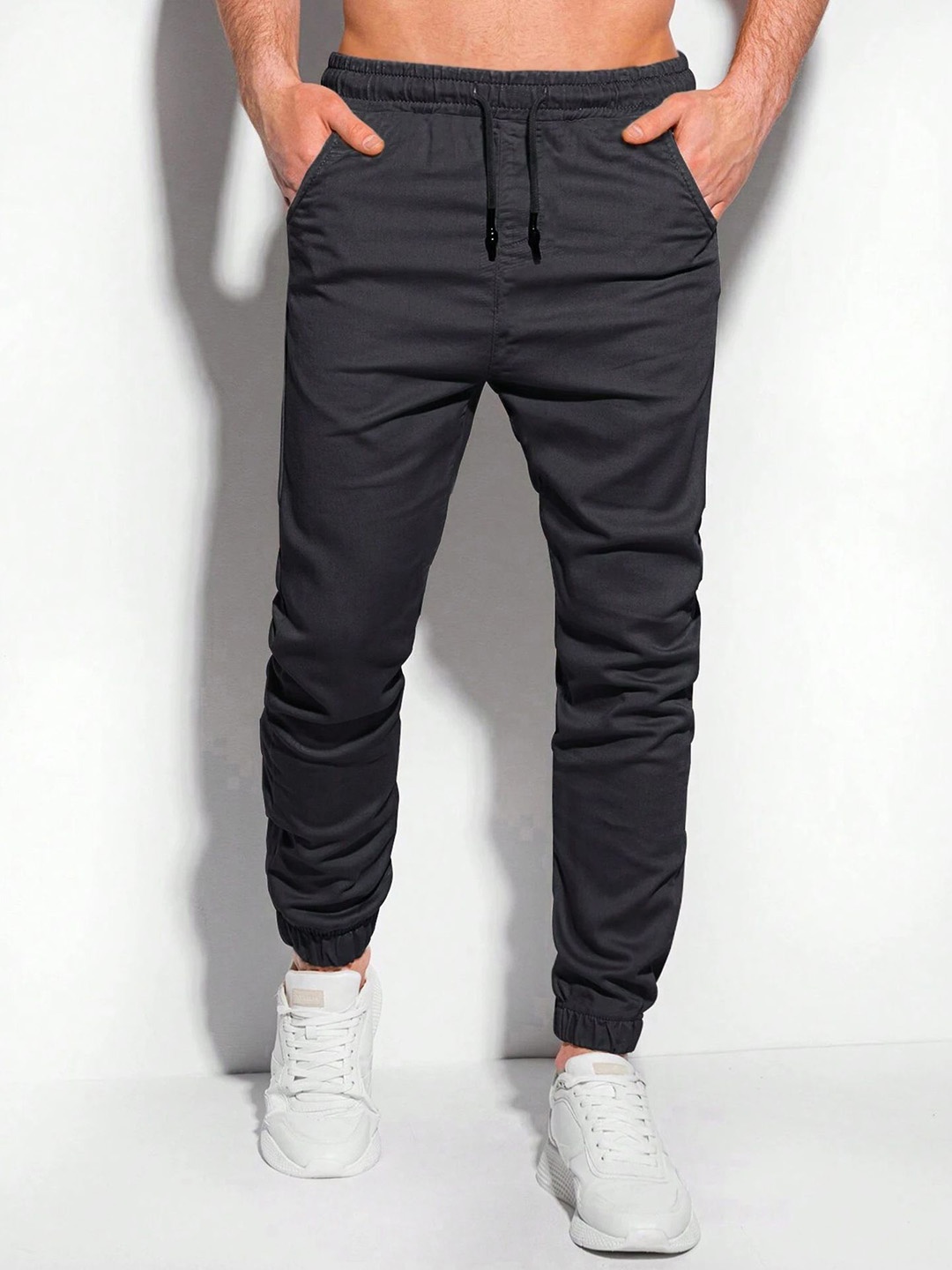 

StyleCast x Revolte Men Solid Mid-Rise Joggers, Black
