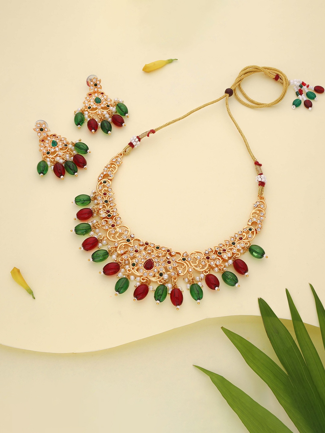 

Lyriss Gold-Plated American Diamond Studded & Beaded Jewellery Set