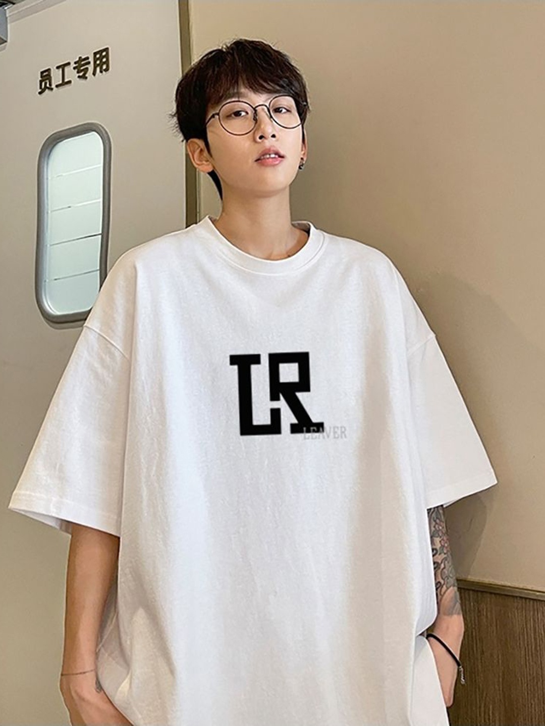 

StyleCast x Revolte Men Graphic Printed Round Neck Cotton Oversized T-shirt, White
