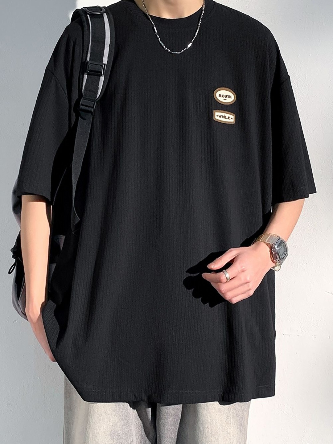 

StyleCast x Revolte Men Solid Round Neck Oversized T-shirt, Black