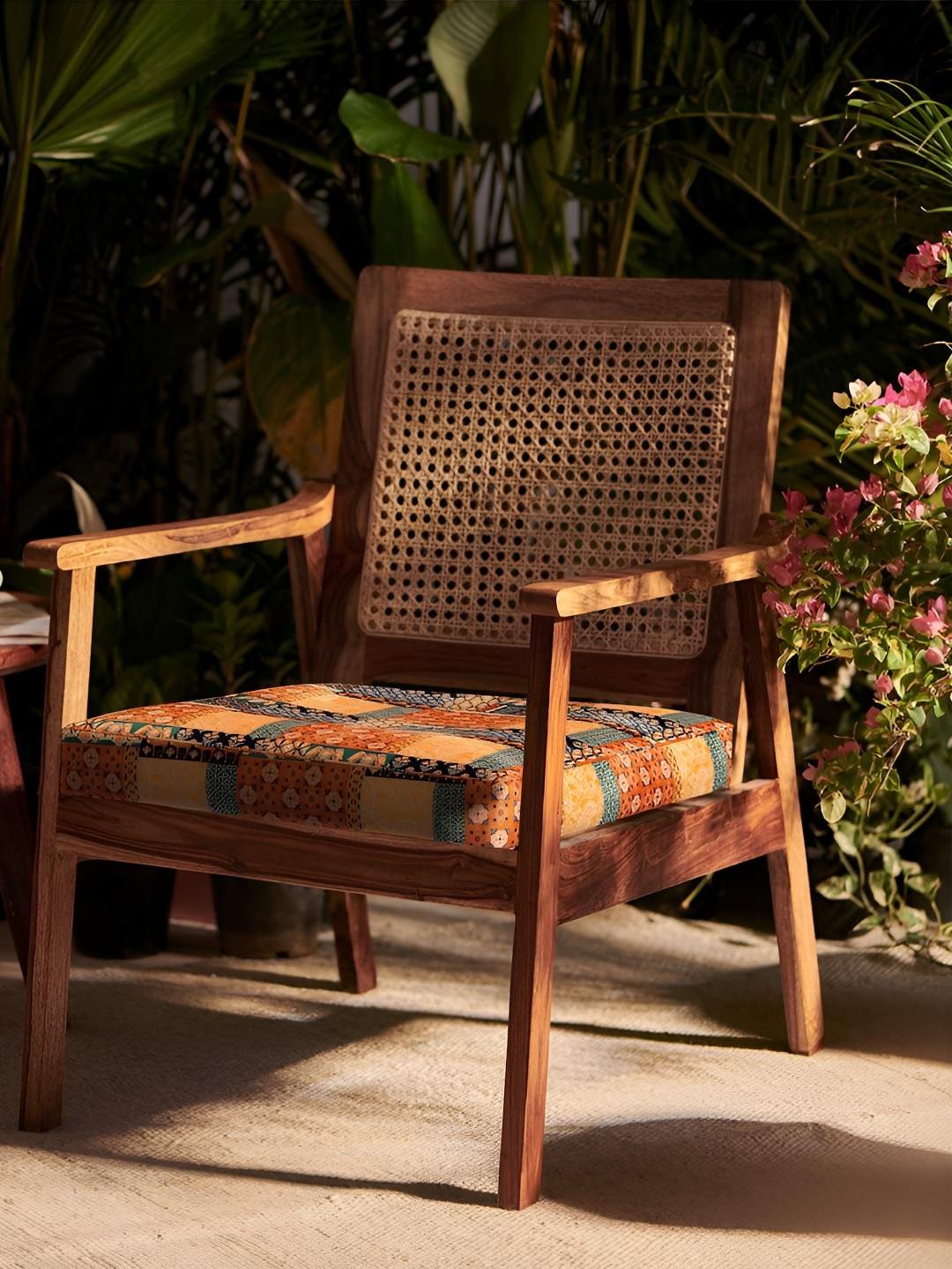 

Chumbak French Rattan Red & Brown Boho Patches Wooden Lounge Chair