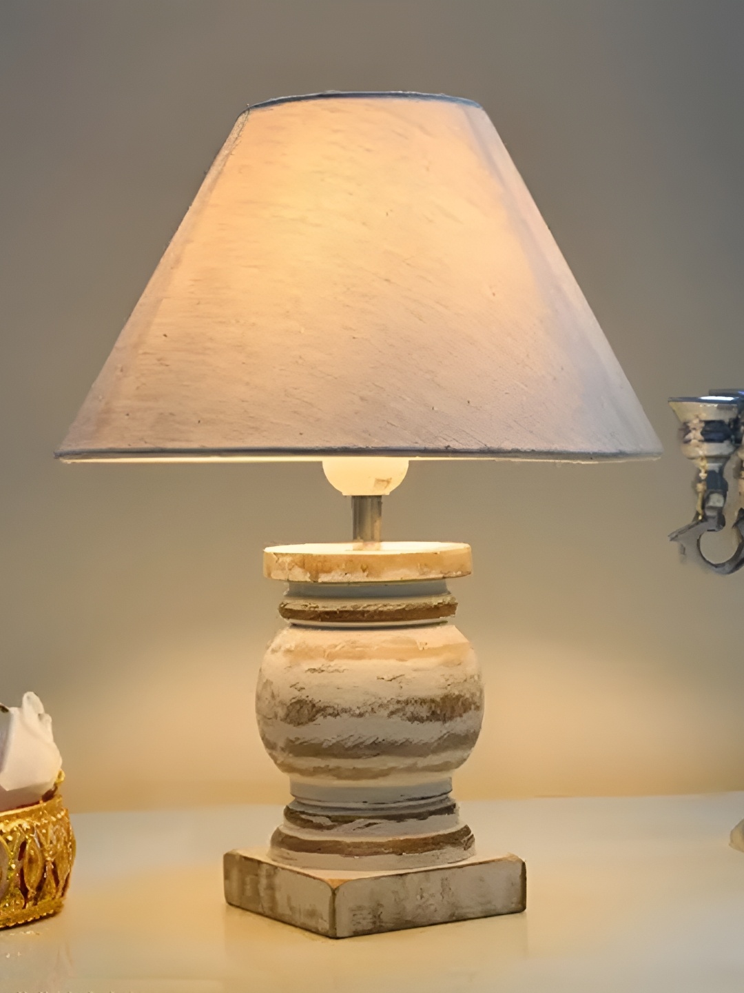 

Homesake Beige & White Textured Wooden Frustum Shaped Table Lamp