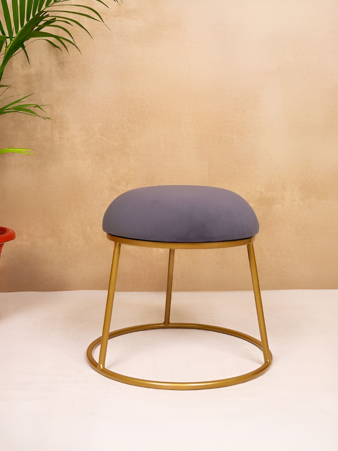 

Decoghar Grey & Gold-Toned Round Shaped Upholstered Metallic Stool