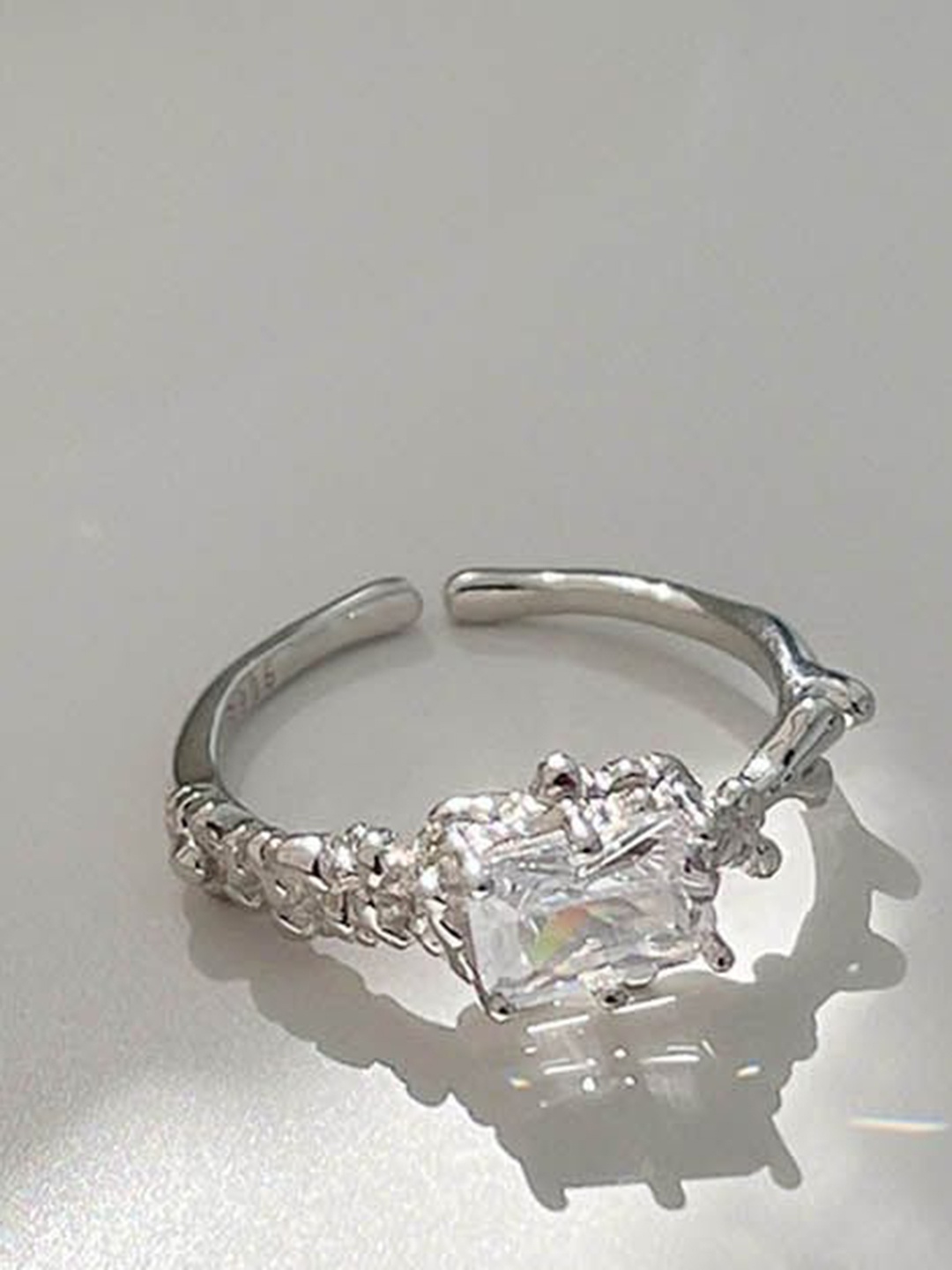 

StyleCast Silver-Toned Silver-Plated Artificial Stone Studded Adjustable Finger Ring