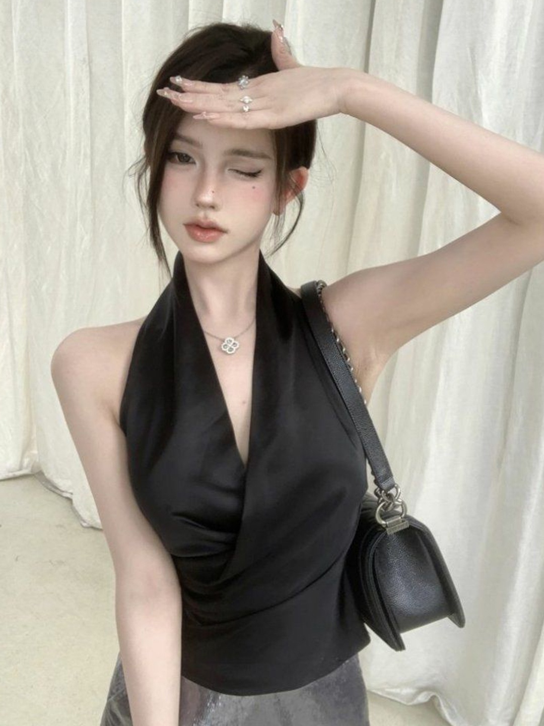 

StyleCast x Revolte Solid Halter Neck Sleeveless Wrap Top, Black
