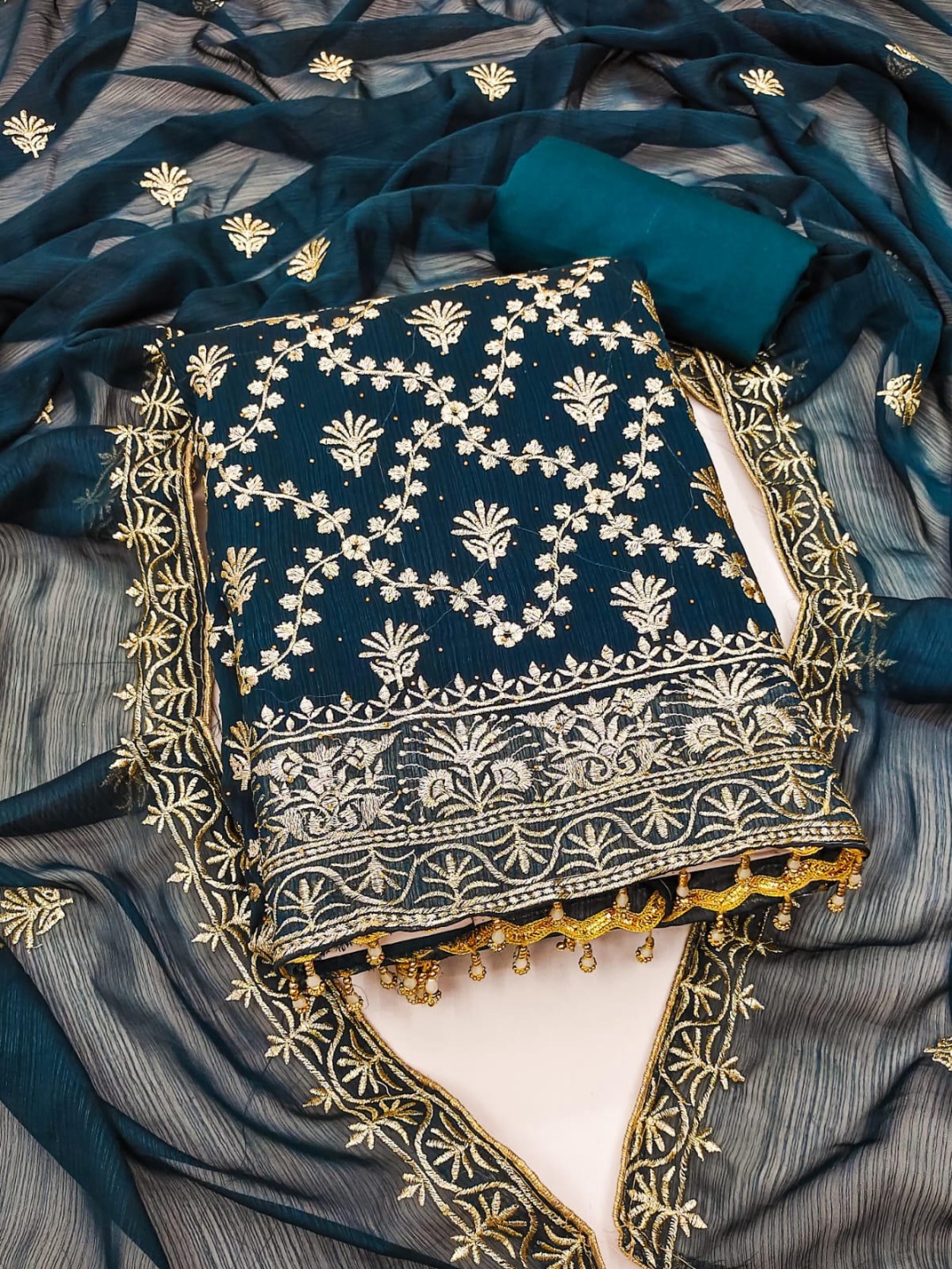 

SWARNGANGA TEX Floral Embroidered Zari Work Georgette Unstitched Dress Material, Blue