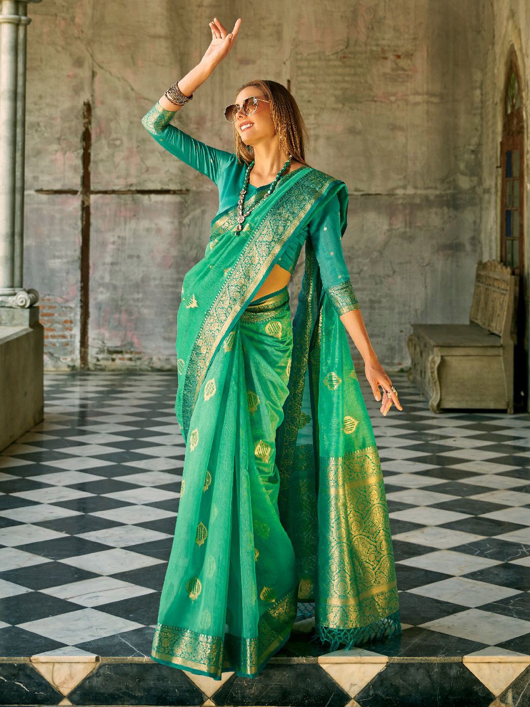 

Mitera Ethnic Motifs Woven Design Zari Tissue Saree, Green