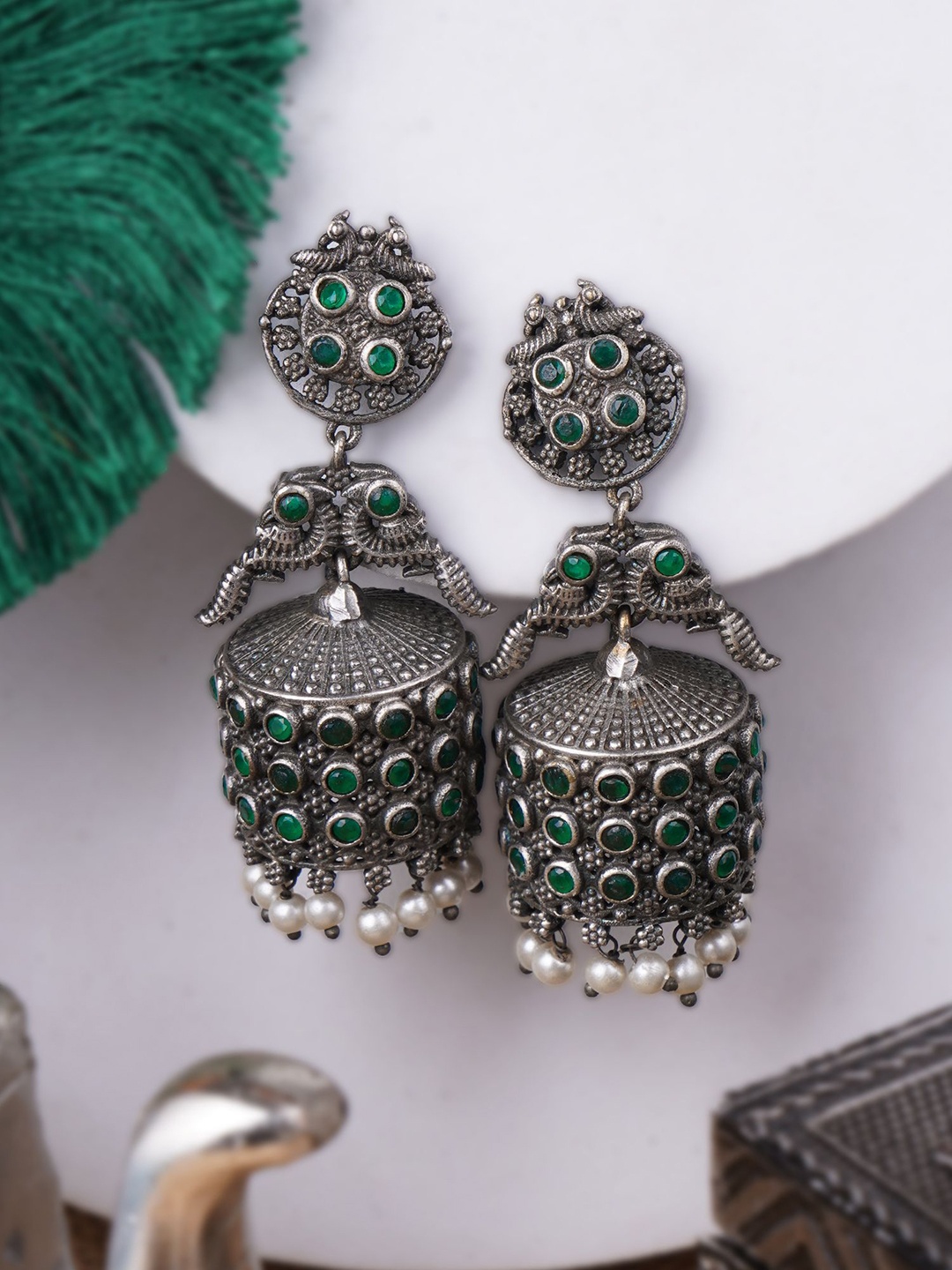 

Sangria Green Silver-Plated Artificial Stones Studded & Pearls Beaded Oxidised Jhumkas