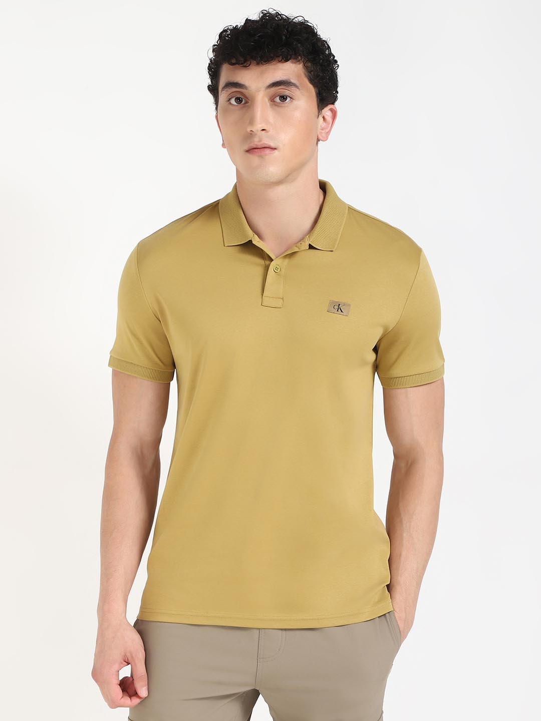 

Calvin Klein Men Solid Polo Collar Cotton T-shirt, Yellow