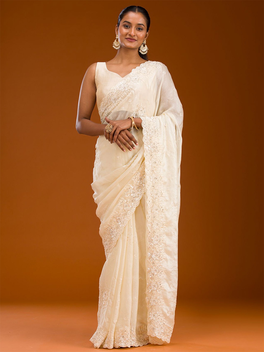 

Koskii Cream Sequins Chiffon Saree