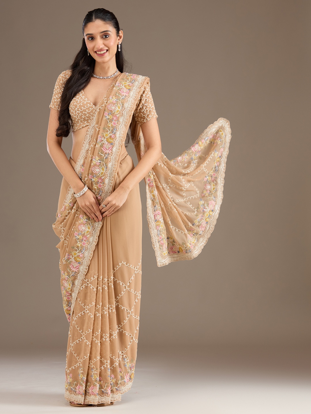 

Koskii Sequinned Beige Embellished Tissue Saree