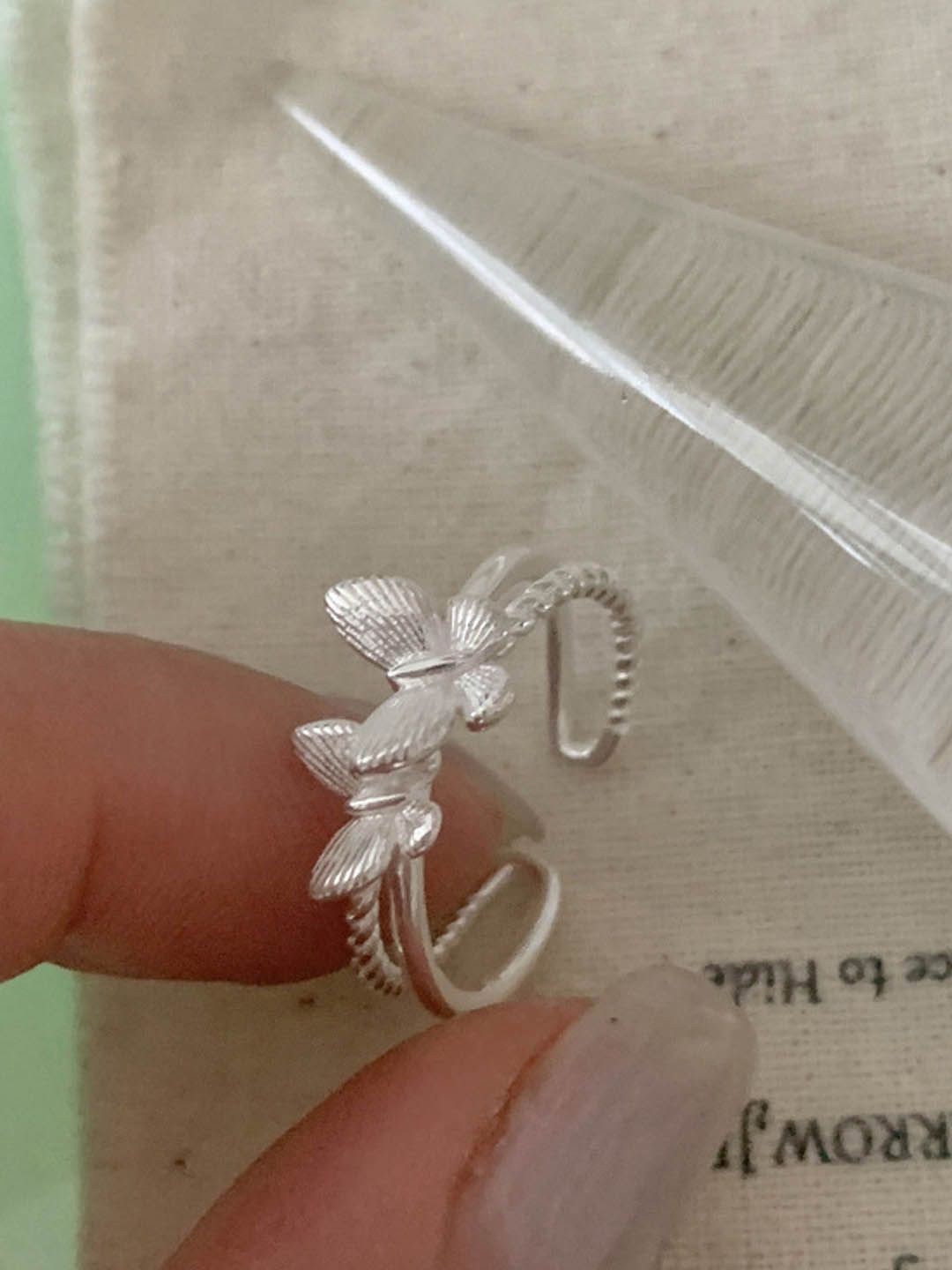 

StyleCast Silver-Toned Silver-Plated Butterfly Shaped Adjustable Finger Ring