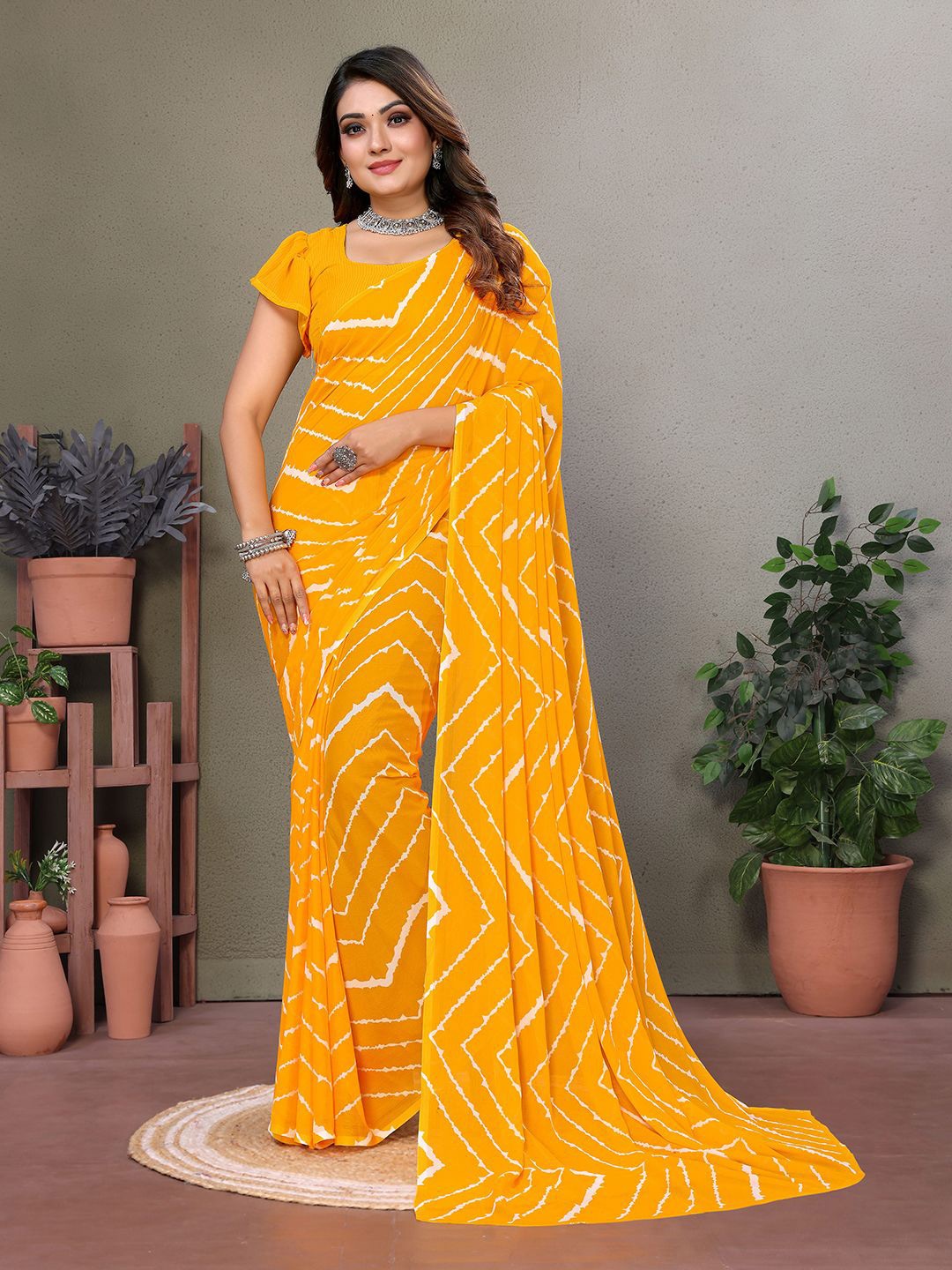 

Moda Rapido Leheriya Printed Saree, Yellow