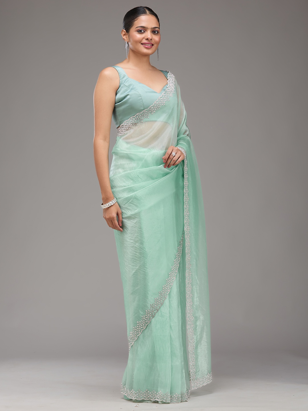 

Koskii Green Embellished Tissue Saree