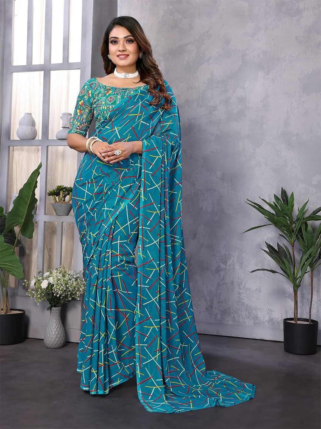 

Moda Rapido Abstract Printed Saree, Blue