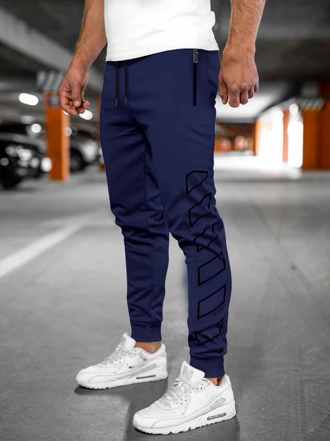 

StyleCast x Revolte Men Printed Slim Fit Easy Wash Joggers Trousers, Blue