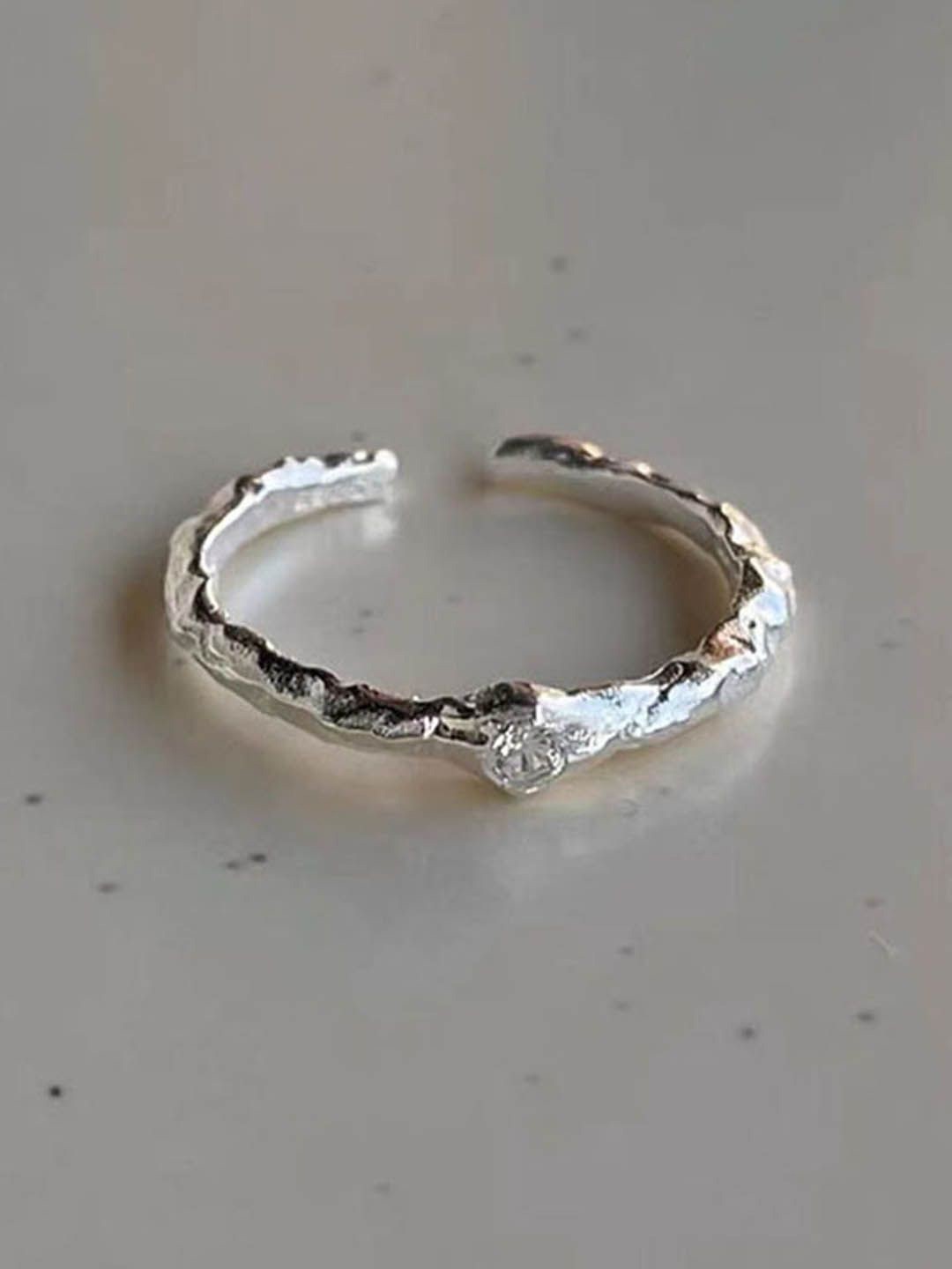

StyleCast Silver-Plated Stone-Studded Round shaped Adjustable Finger Ring