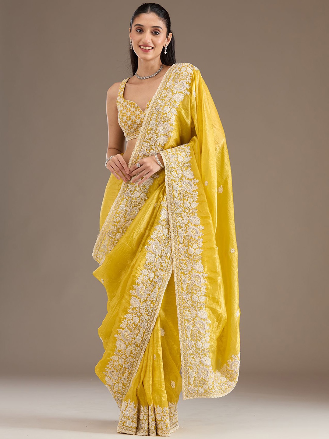 

Koskii Floral Heavy Work Yellow Embellished Tissue Saree