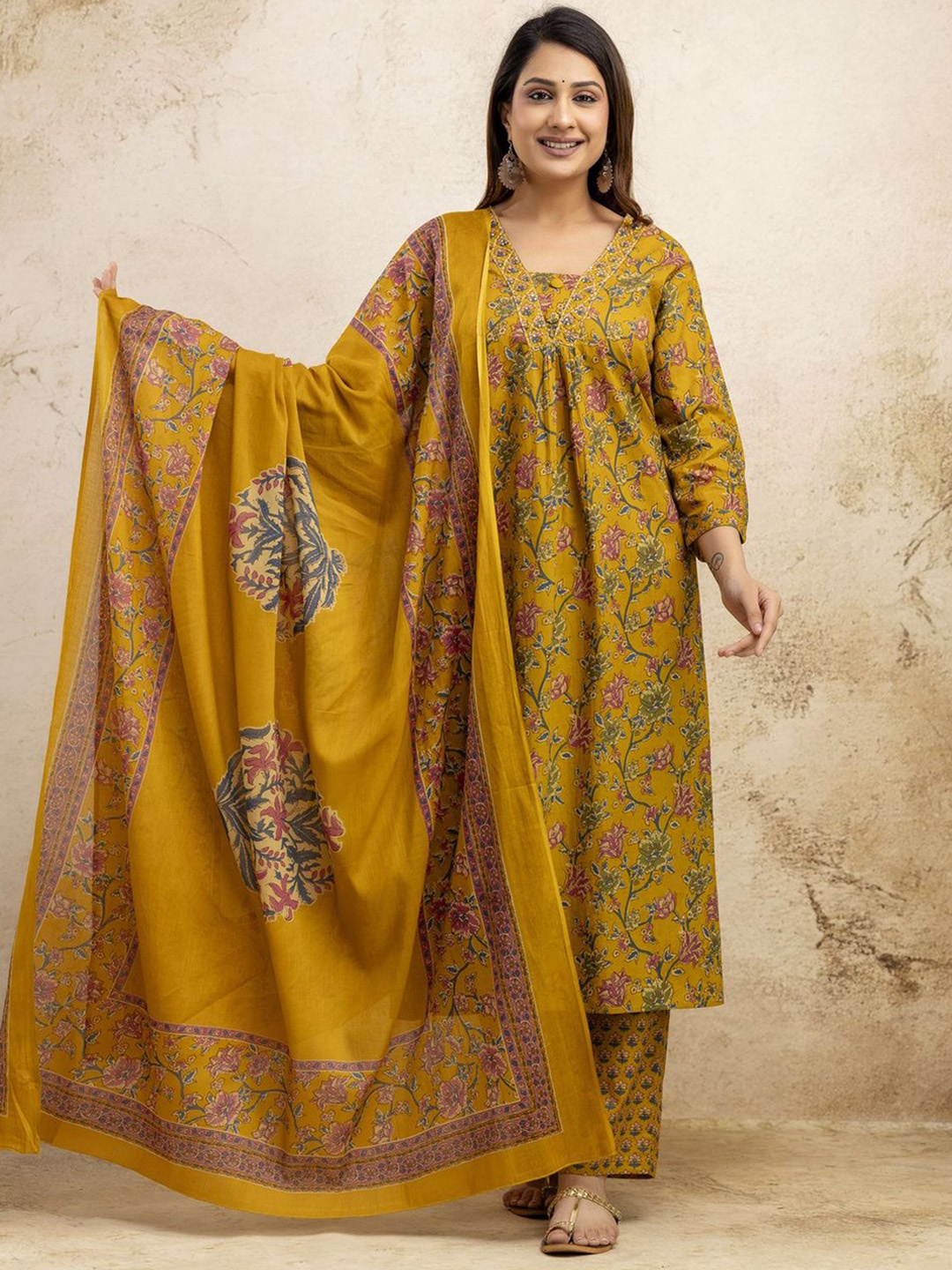 

NISHIRE Floral Printed V-Neck Pleated Pure Cotton A-Line Kurta With Trouser & Dupatta, Mustard
