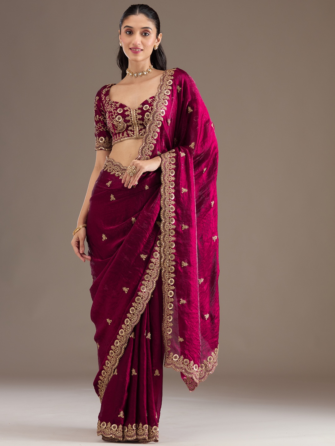 

Koskii Dark Maroon Embellished Tissue Saree