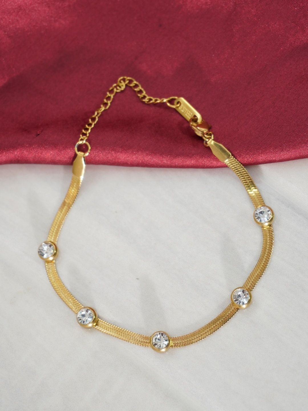 

Niscka Gold-Plated Artificial Stones Studded Charm Bracelet