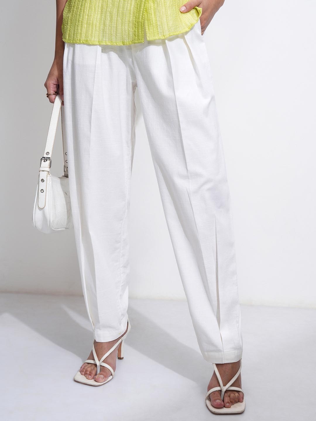 

Tokyo Talkies Women Solid Linen Front Pleated Carrot Pants, Off white